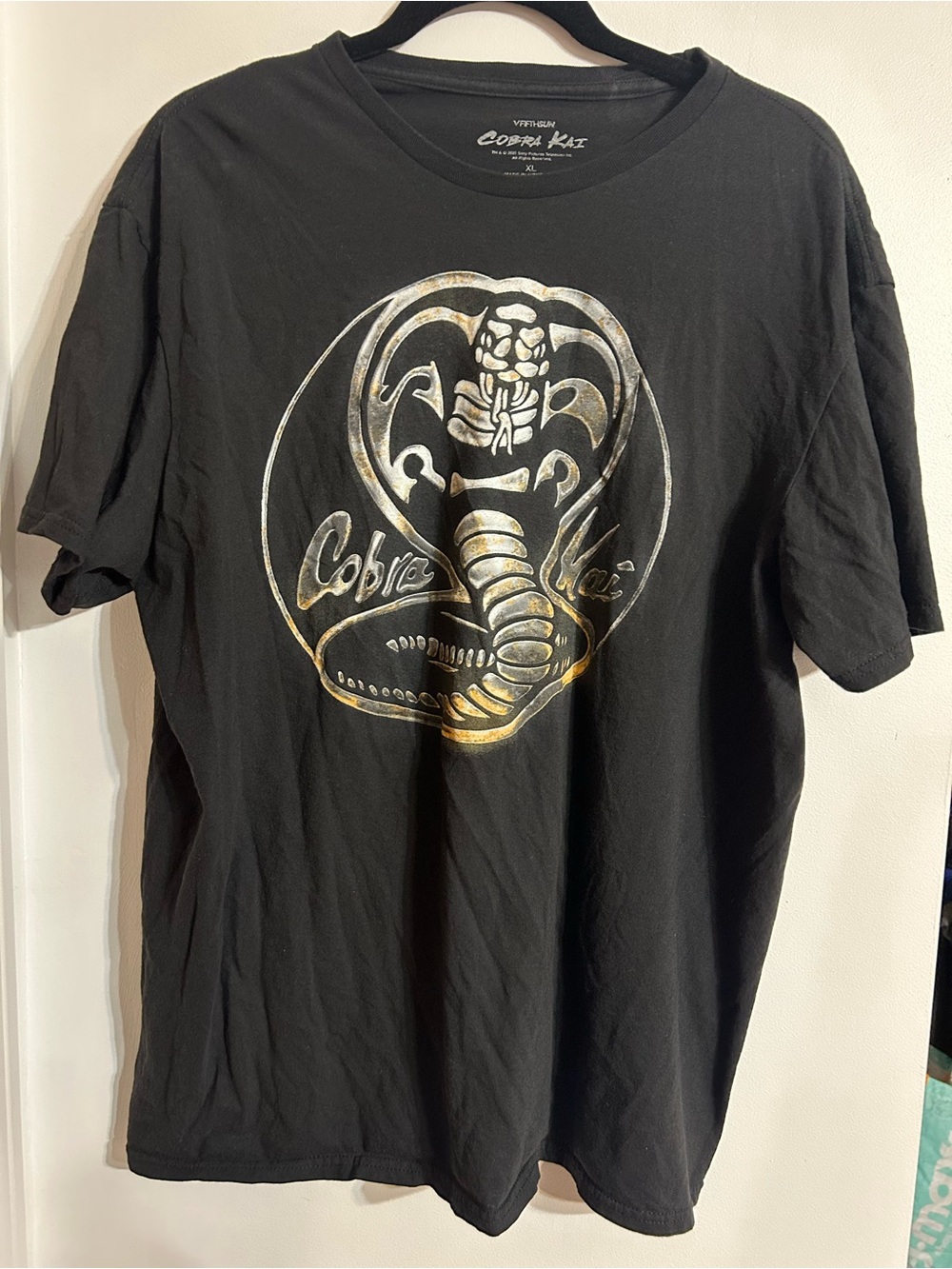 Black Short-Sleeve Graphic Tee with Metallic Cobra Emblem
